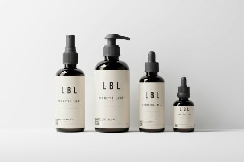 a group of four cosmetic bottles